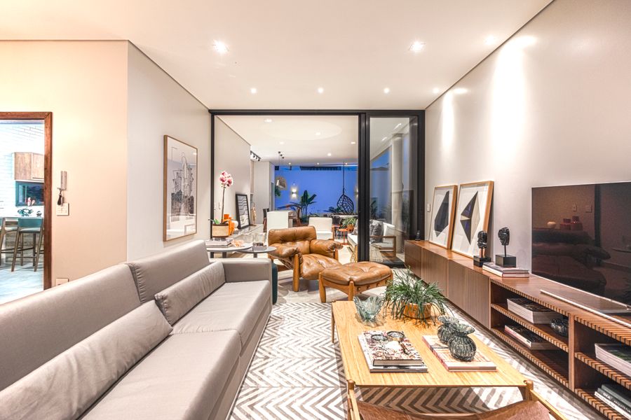 Living room arranged with a sofa, leather armchair and coordinated furnishings