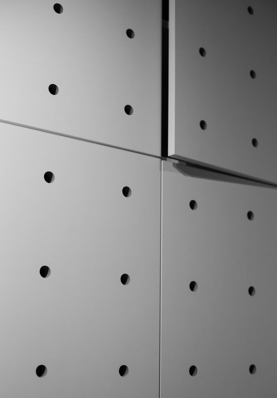 Close-up of fitted perforated acoustic wall panels