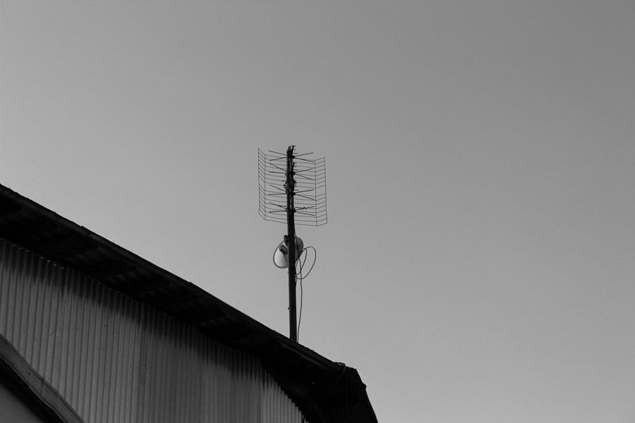 Television aerial mounted above a roof