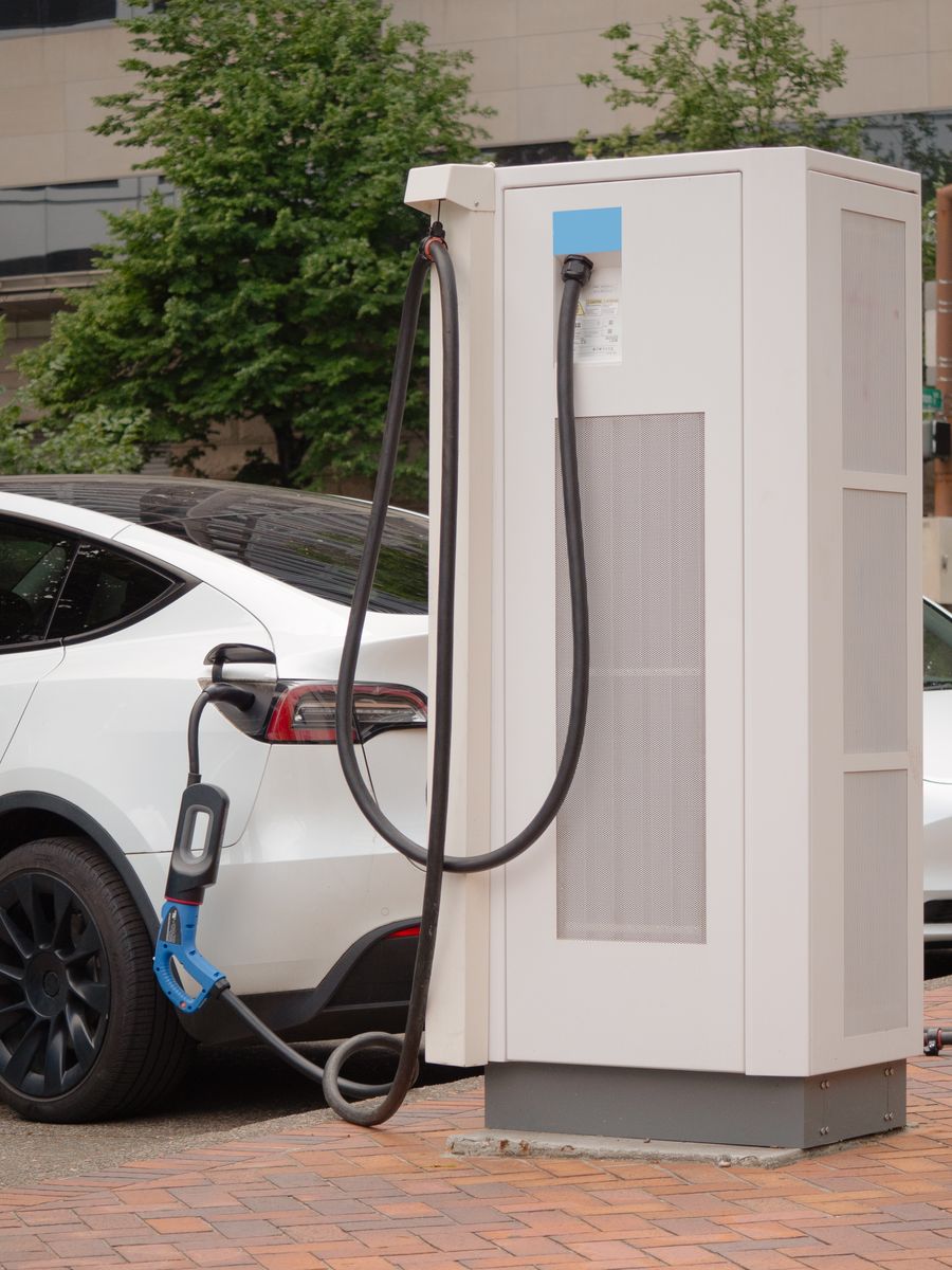 Electric vehicle connected to an outdoor charging station