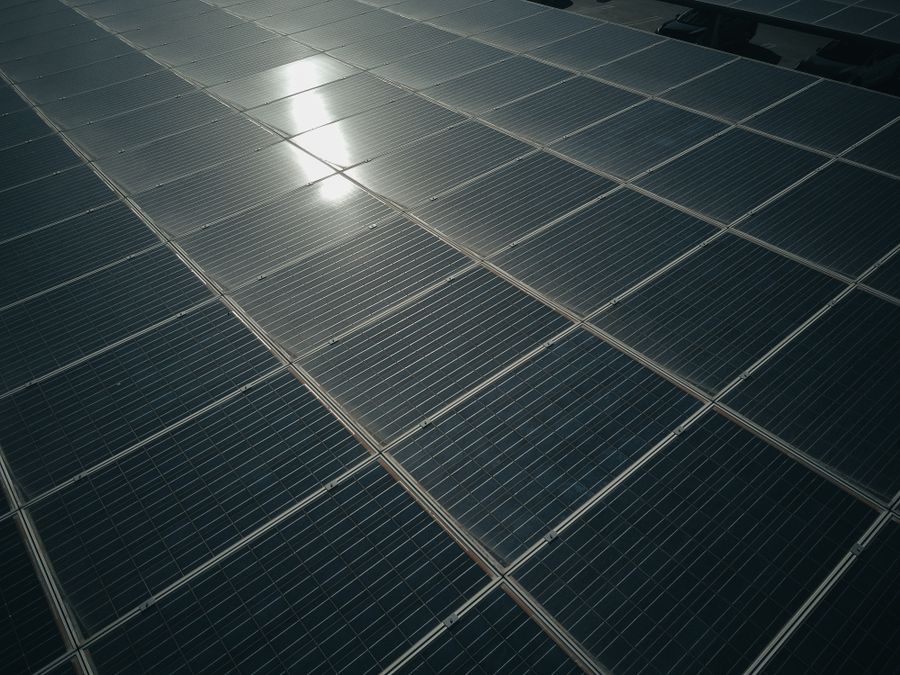 Close-up of photovoltaic solar panels reflecting sunlight